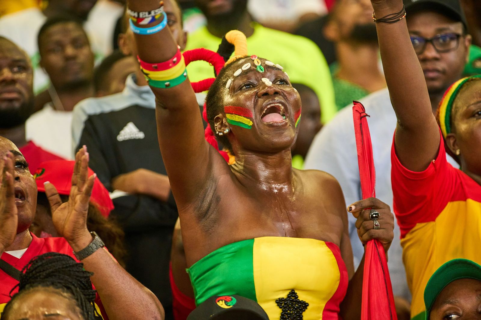 A Ghana supporter cheering in the stands