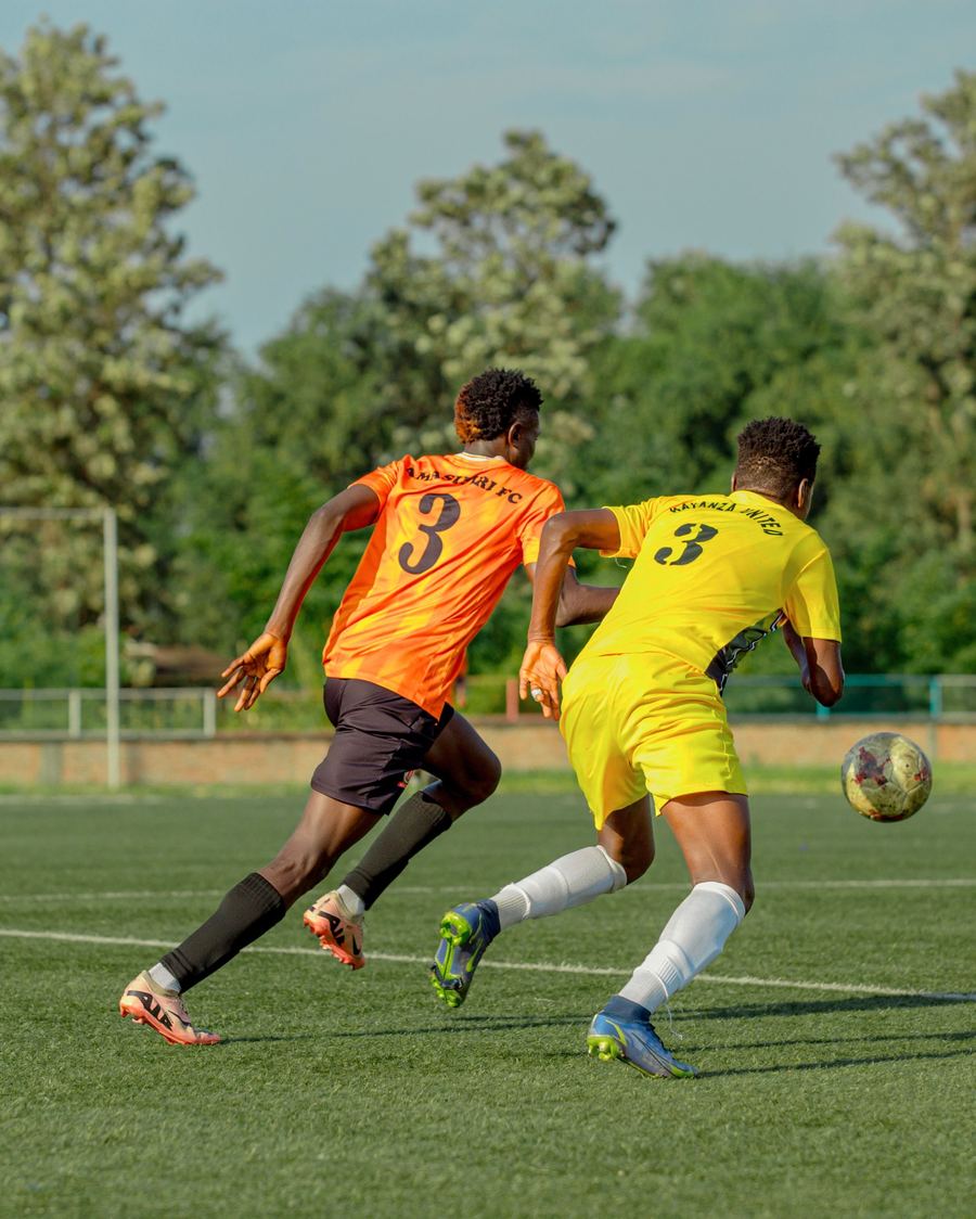 Two club players chasing the ball